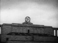 Swastika_blasted_from_the_Nazi_party_rally_grounds_-_Nuremberg_(1945).gif