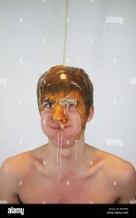 golden-syrup-male-subject-pouring-MATF8K.jpg