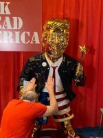 Trump-golden-statue-man-bows-down (1).jpg