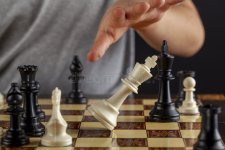 close-up-image-end-chess-game-where-losing-player-resigns-tipping-over-his-king-image-shows-as...jpg