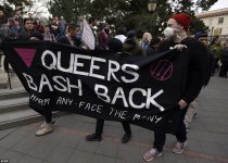 3CBEBF4900000578-4182824-People_carry_a_banner_which_reads_Queers_bash_back_at_the_protes-a-2...jpeg