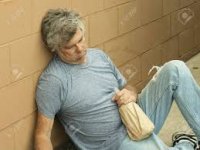 Homeless Man With His Bottle Passed Out ...